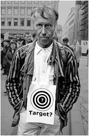 "Target?" - From an exhibit of 1999 Serbia/Kosovo war photos taken by German photographers Anneliese Fikent and Andreas Neumann. Thousands of defiant Belgrade citizens wore the antiwar target symbol as they gathered on Serbia’s historic bridges spanning the Danube River - all in an effort to save the structures from NATO bombardment. Fifty-five bridges were destroyed by NATO missiles and bombs.