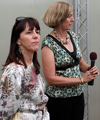 Susan Macdonald (left), Head of Field Projects for the Getty Conservation Institute, and Leslie Rainer, Senior Project Specialist for the Getty Conservation Institute, address the public and members of the news media on the rooftop of Olvera Street's Italian Hall, where the Siqueiros mural is located. Photo by Mark Vallen ©