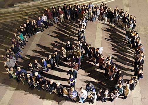 At the end of the vigil, participants formed a giant peace sign in the museum's plaza. This photograph was taken from the museum's rooftop. Photo by Mark Vallen ©.
