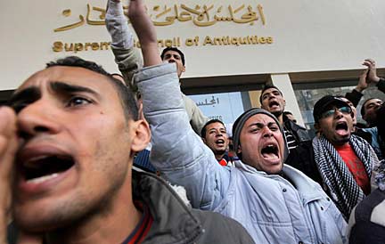  "Get Out!" Nearly 200 demonstrators chant a message to Hawass in front of the Supreme Council of Antiquities, Feb. 14, 2011. AP Photo/Ben Curtis.