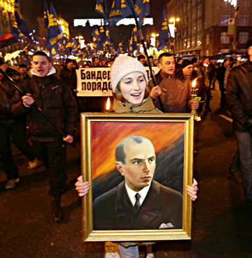 During the Maidan protests, Svoboda organized a Jan. 1, 2014 torchlight march in Kiev to honor Ukraine's WWII era ultranationalist, Stepan Bandera (1909-1959). The procession was held on what would have been Bandera's 105th birthday. 15,000 extremists carried Svoboda banners and the red and black battle flag of Bandera's paramilitary, the Ukrainian Insurgent Army. (AP Photo by Efrem Lukatsky).