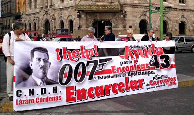 Pro-democracy activists near the filming location of Spectre, hold a banner that reads: "Help! 007, we request your help finding the 43 students of Ayotzinapa." Photo/Arcelia Maya